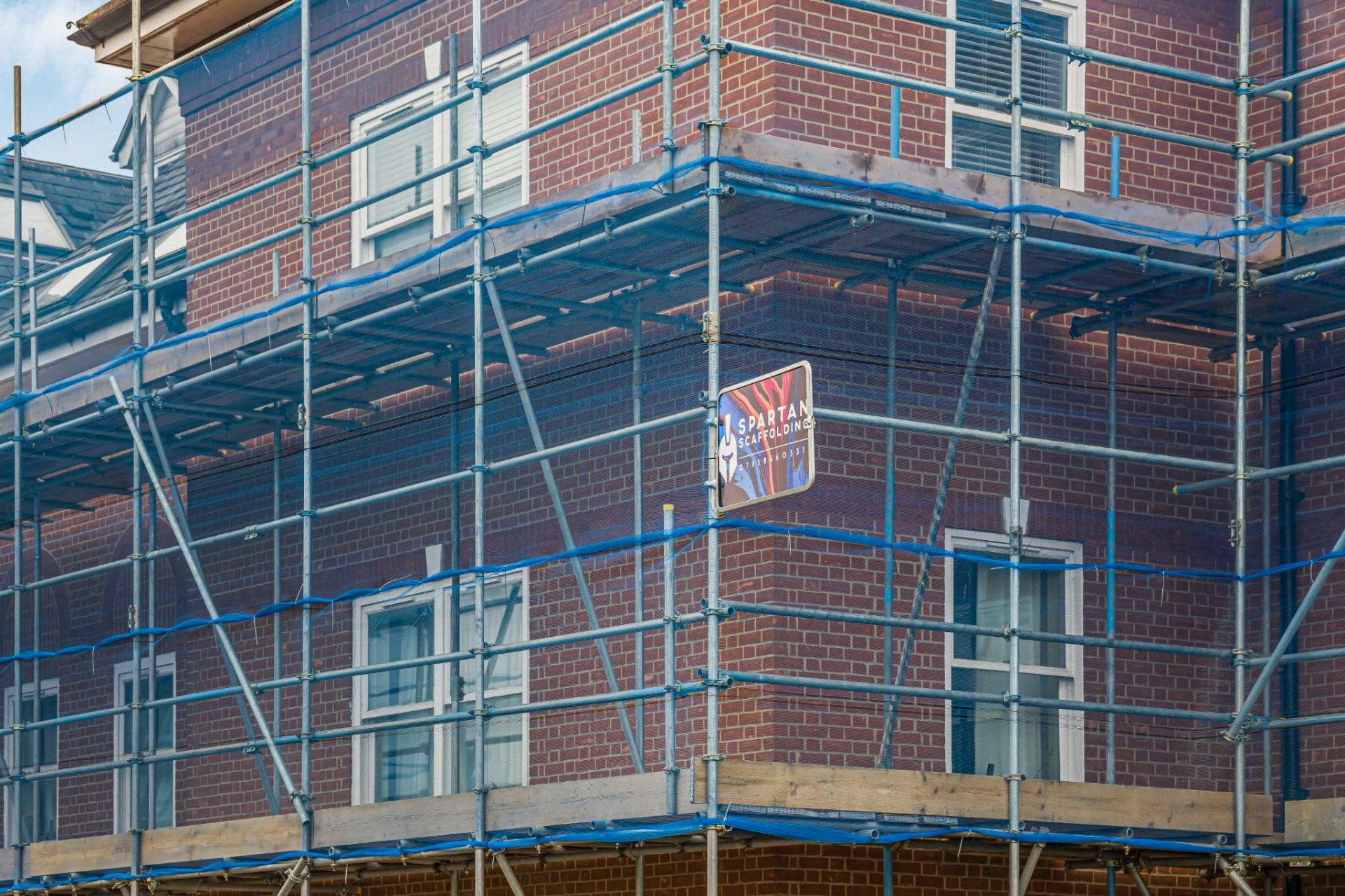 Scaffold around a brick residential building for exterior works