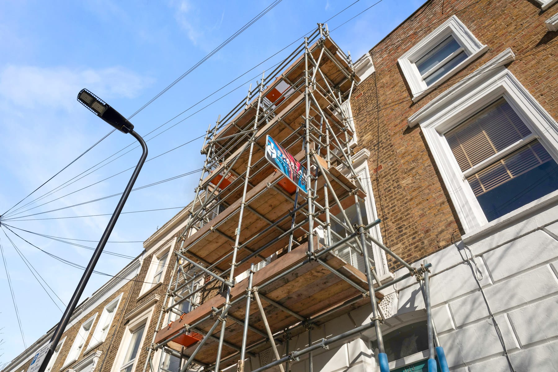 Large apartment block scaffolded for façade works