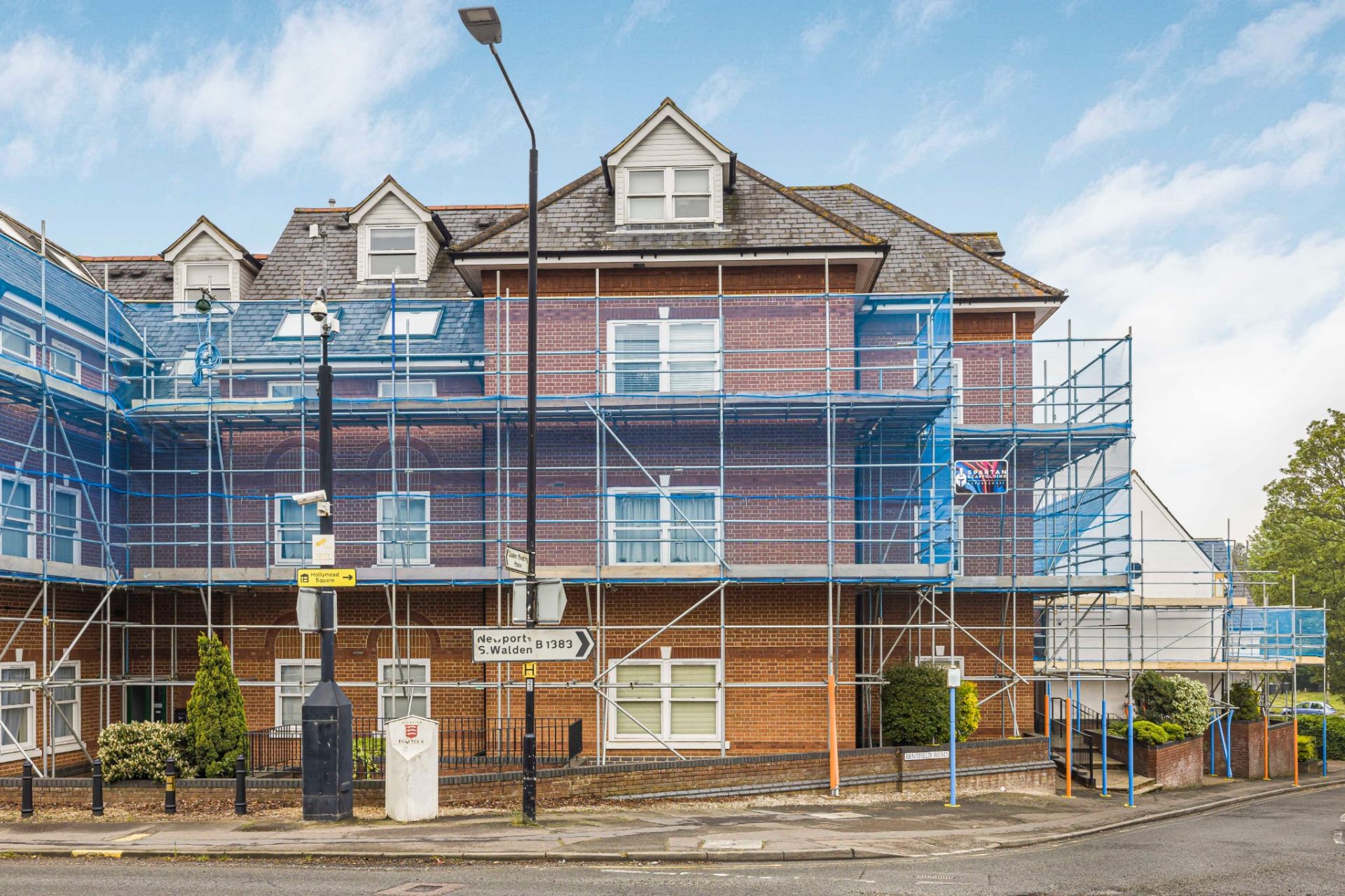 Sheeted temporary roof scaffolding installed over a residential property in Braintree, Essex