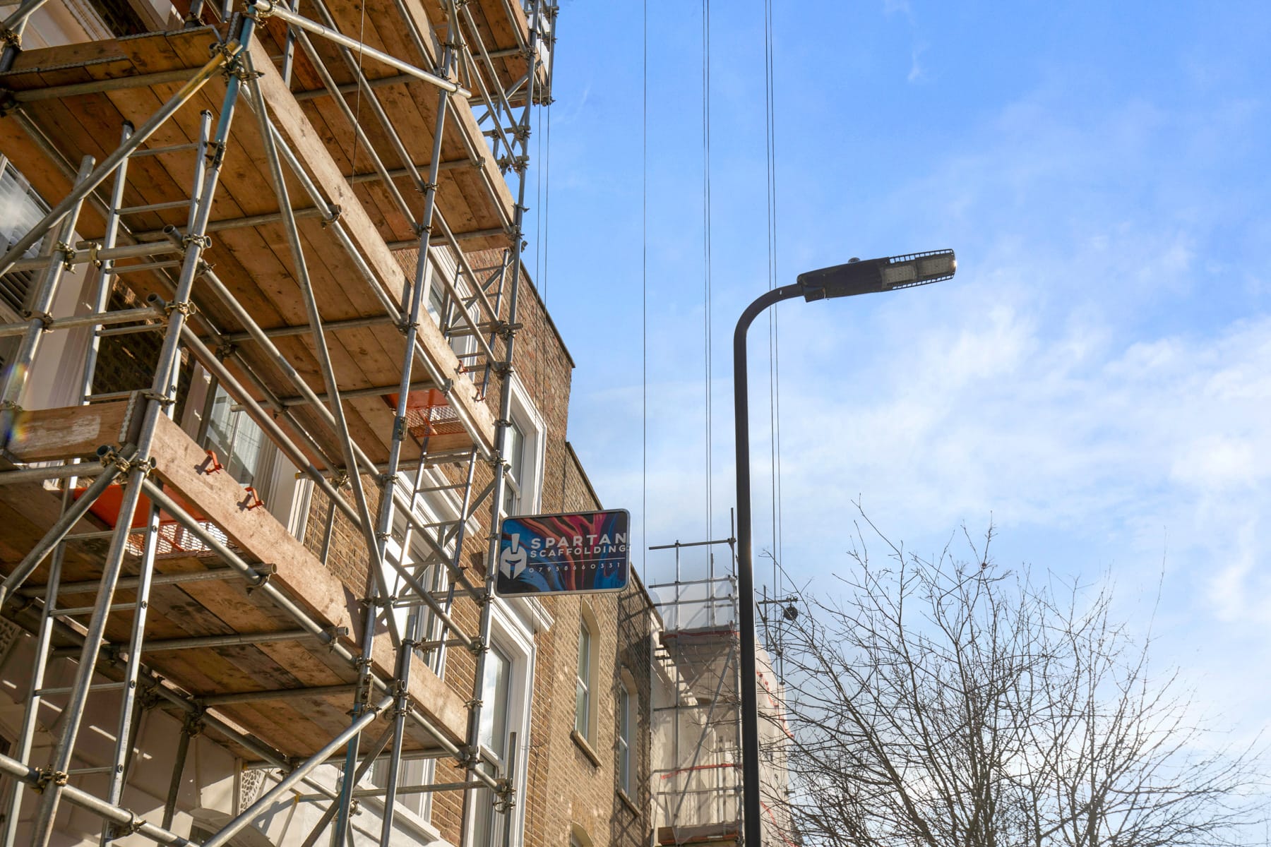 Scaffold across a row of terraced houses