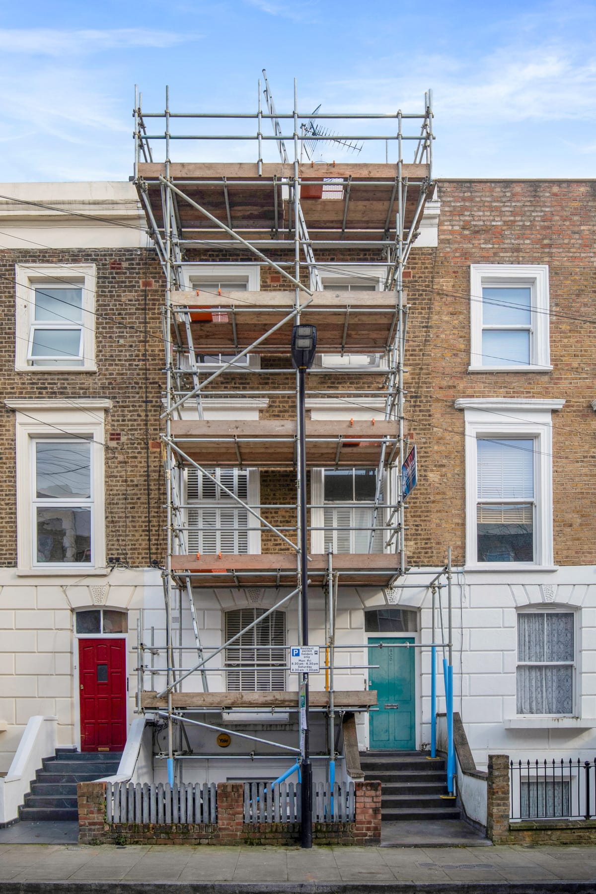 Scaffold across terraced houses ready for roofing works
