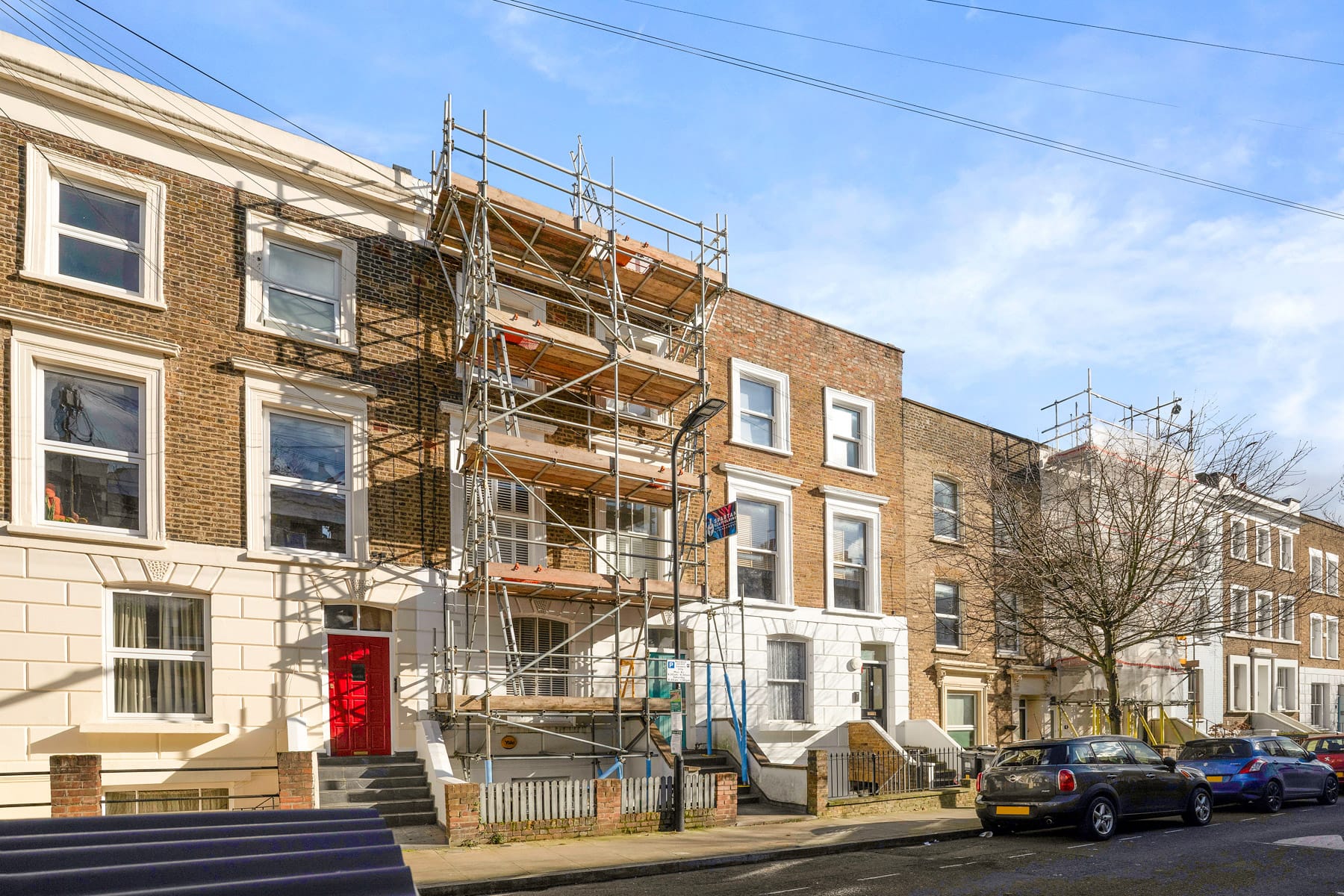 Scaffold across a row of terraced homes in Essex