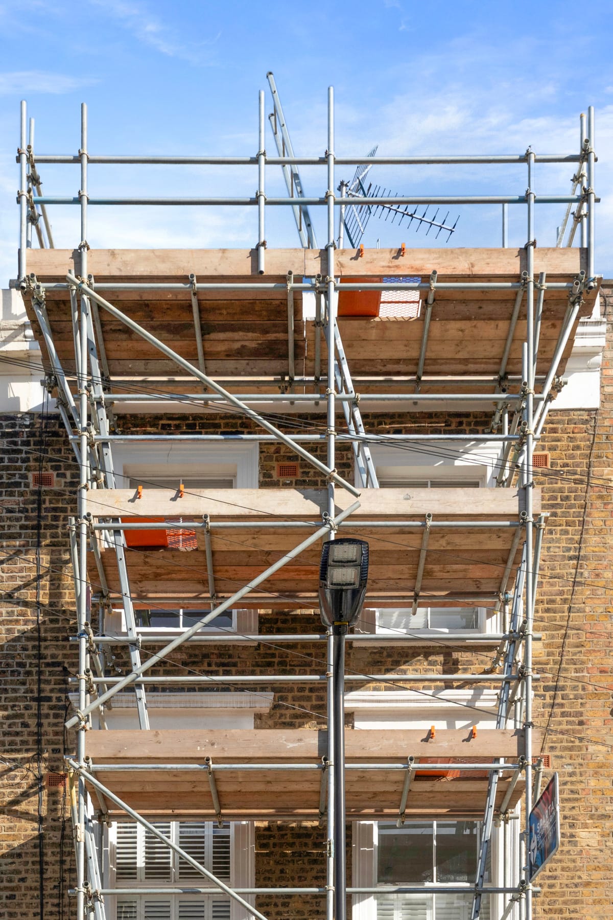 Residential scaffold on a brick house facade