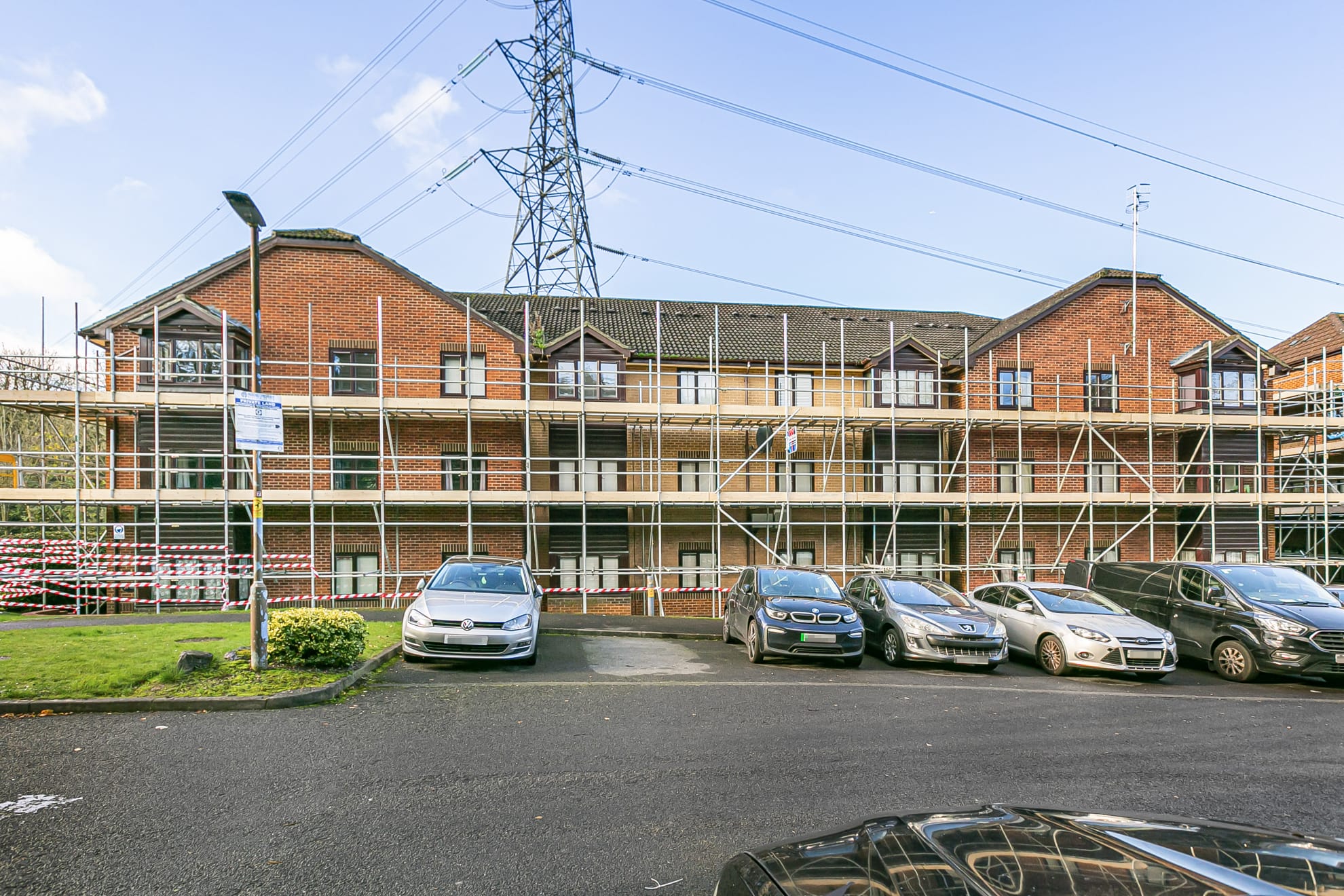 Full perimeter scaffold across a row of terraced houses on weekly hire