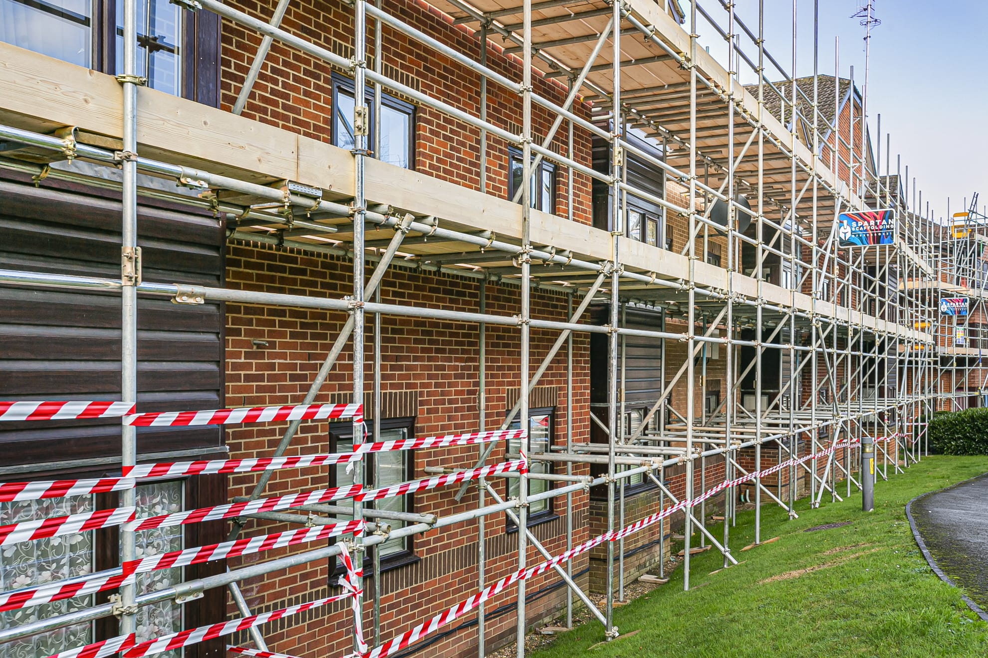 Boarded scaffold on a brick residential property
