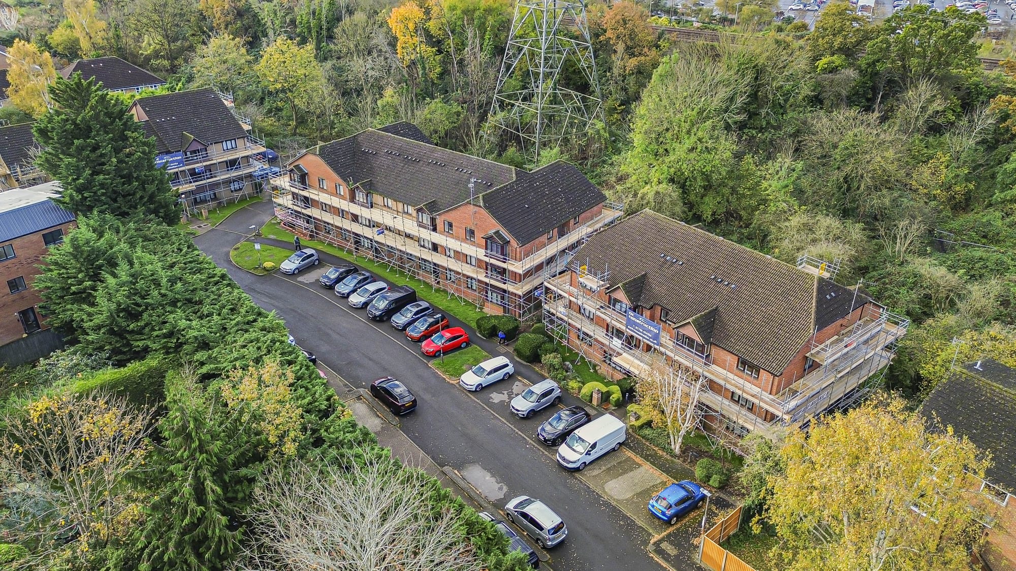 Apartment block scaffolded with parking access maintained
